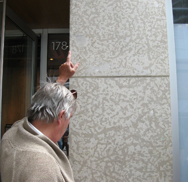 Tako Koning in front of a piece of Tyndall stone